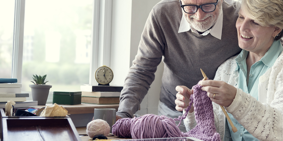 One reason independent living communities in Harvard, Illinois can help seniors feel happier is more time to learn a new hobby, like knitting.
