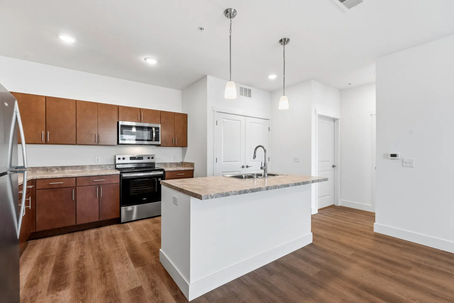 Lumin Terrace Unit 104 - Side View Kitchen and Hall